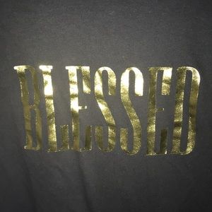 Regular black tee that says “BLESSED” on it.